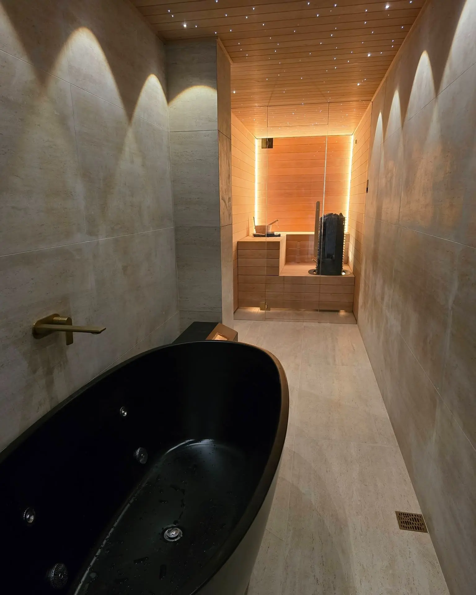 Luxury residential sauna with cedar wood walls and warm ambient lighting
